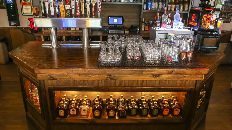 Bar area with liquor bottles and beer taps